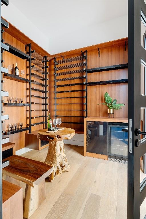 106 Bella Montagna Cir, Austin, TX 78734 - wine room featuring beverage cooler and wood finished floors