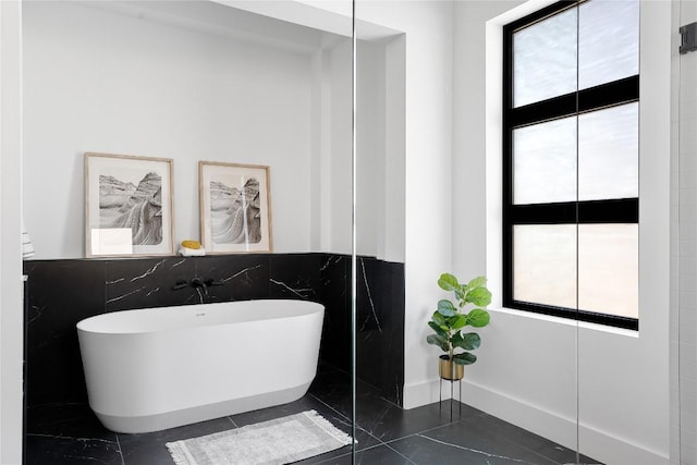 106 Bella Montagna Cir, Austin, TX 78734 - bathroom with a freestanding bath and tile walls
