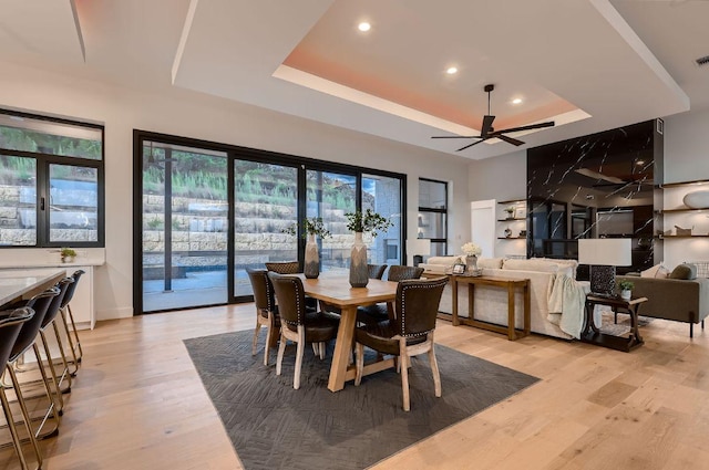 106 Bella Montagna Cir, Austin, TX 78734 - dining room with a tray ceiling, light wood-style floors, recessed lighting, and ceiling fan