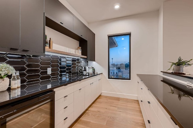 106 Bella Montagna Cir, Austin, TX 78734 - kitchen featuring beverage cooler, light wood-type flooring, open shelves, decorative backsplash, and recessed lighting