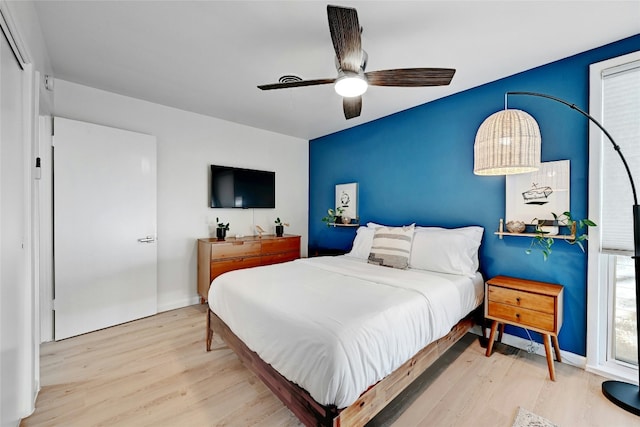 1205 Westmoor Dr, Austin, TX 78723 - bedroom with wood finished floors, ceiling fan, and baseboards