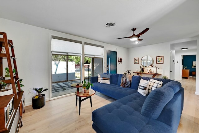 1205 Westmoor Dr, Austin, TX 78723 - living area featuring light wood-style flooring, a ceiling fan, and baseboards