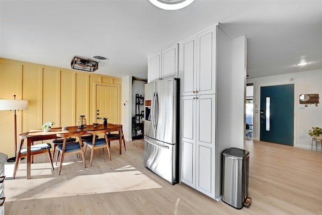 1205 Westmoor Dr, Austin, TX 78723 - kitchen featuring stainless steel fridge and light wood-style floors