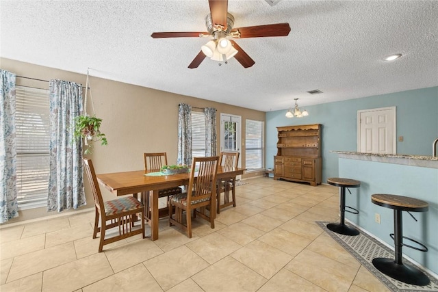2103 Heather Dr, Cedar Park, TX 78613 - dining space with a textured ceiling, a ceiling fan, and light tile patterned floors