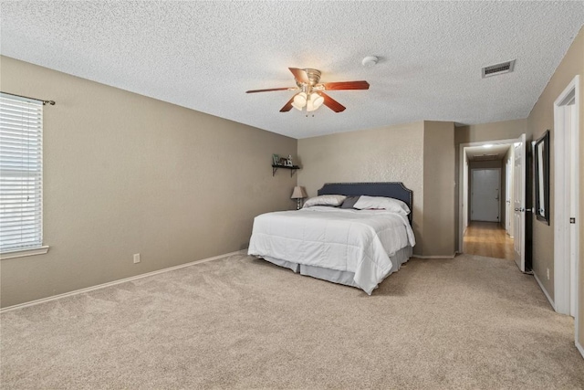 2103 Heather Dr, Cedar Park, TX 78613 - bedroom featuring light carpet, multiple windows, a textured ceiling, and a ceiling fan