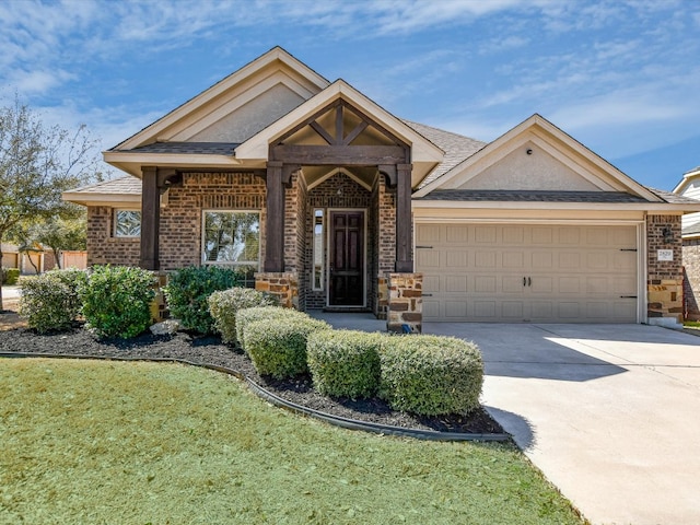 2829 Homecoming, Leander, TX 78641 - view of front facade featuring brick siding, driveway, and a garage