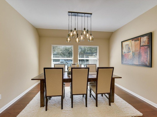 2829 Homecoming, Leander, TX 78641 - dining space with dark wood-style floors, a chandelier, and baseboards