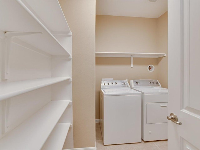 2829 Homecoming, Leander, TX 78641 - laundry area featuring separate washer and dryer and light tile patterned floors