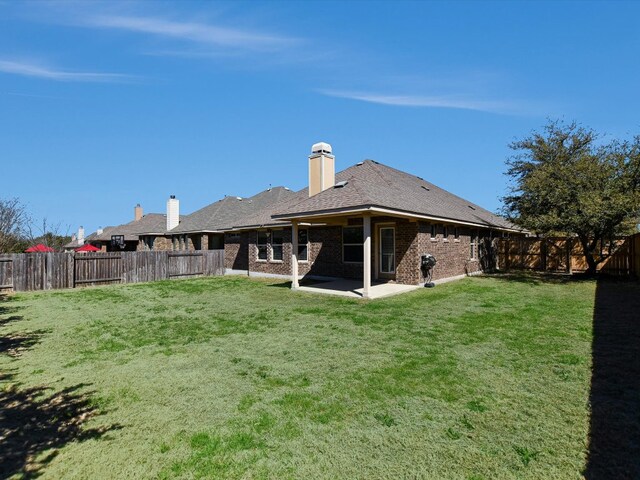 2829 Homecoming, Leander, TX 78641 - rear view of property featuring a patio area and brick siding