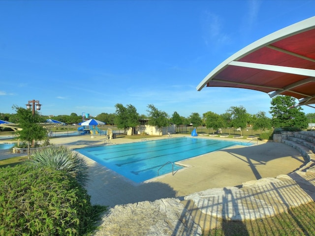 2829 Homecoming, Leander, TX 78641 - community pool featuring a patio