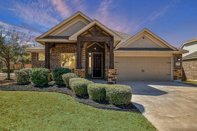 2829 Homecoming, Leander, TX 78641 - view of front of home featuring driveway, brick siding, and an attached garage