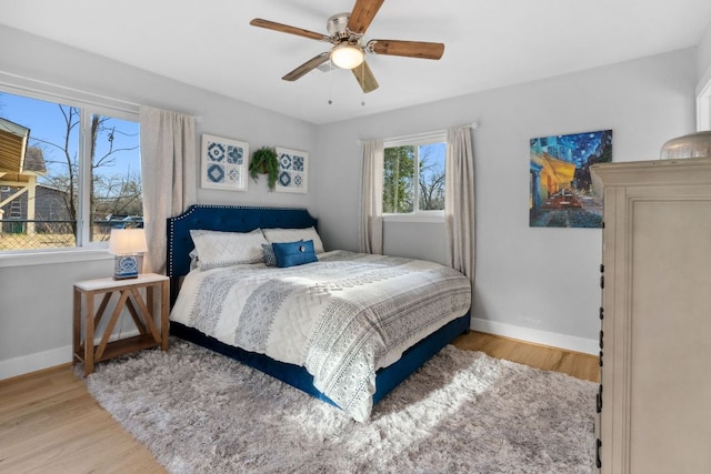 5307 Halmark Dr, Austin, TX 78723 - bedroom with wood finished floors and ceiling fan