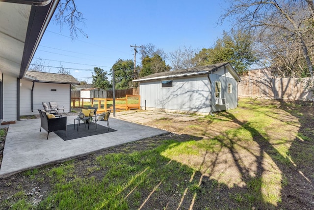 5307 Halmark Dr, Austin, TX 78723 - fenced backyard featuring an outdoor structure and a patio area