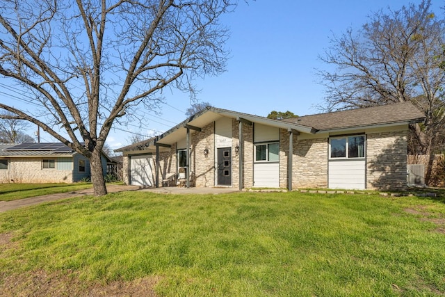 5307 Halmark Dr, Austin, TX 78723 - mid-century home featuring an attached garage, a front yard, concrete driveway, and brick siding