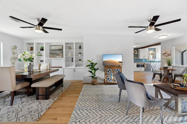 5307 Halmark Dr, Austin, TX 78723 - dining area with a ceiling fan and wood finished floors