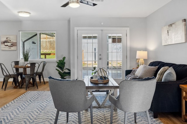 5307 Halmark Dr, Austin, TX 78723 - dining space featuring french doors, healthy amount of natural light, wood finished floors, and a ceiling fan