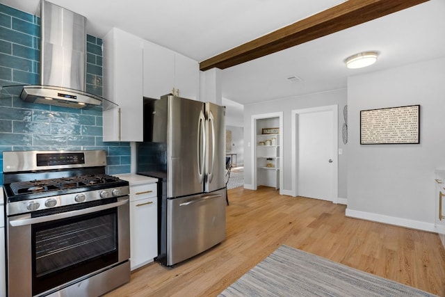 5307 Halmark Dr, Austin, TX 78723 - kitchen featuring stainless steel appliances, wall chimney exhaust hood, tasteful backsplash, light wood-type flooring, and light countertops