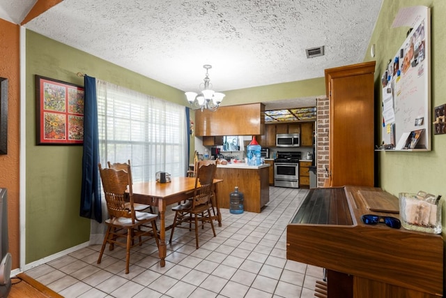 1304 Gatlinburg Dr, Pflugerville, TX 78660 - dining area with visible vents, baseboards, light tile patterned floors, a notable chandelier, and a textured ceiling