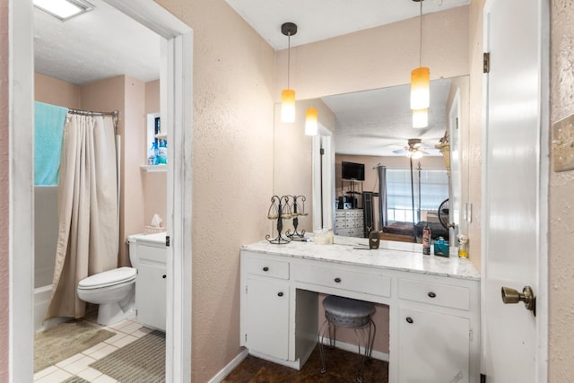 1304 Gatlinburg Dr, Pflugerville, TX 78660 - full bath with visible vents, toilet, a textured wall, vanity, and a ceiling fan