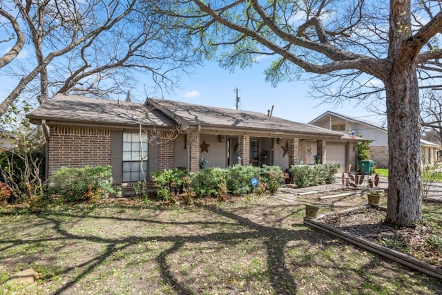 1304 Gatlinburg Dr, Pflugerville, TX 78660 - view of front of home with brick siding and an attached garage