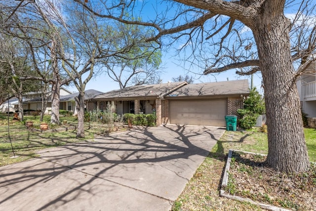 1304 Gatlinburg Dr, Pflugerville, TX 78660 - ranch-style home featuring a garage, brick siding, and aphalt driveway
