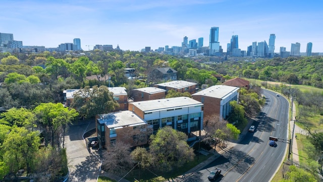 birds eye view of property featuring a city view