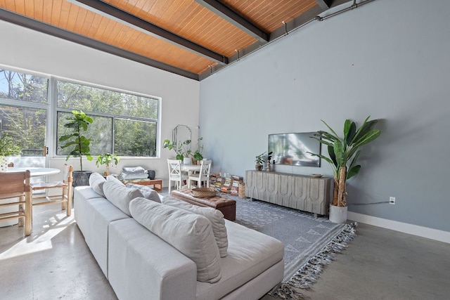 living room with concrete flooring, lofted ceiling with beams, and wood ceiling