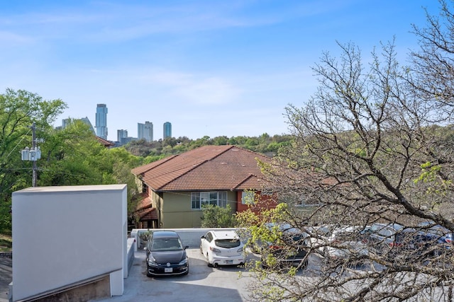 view of home's exterior featuring stucco siding and a tile roof