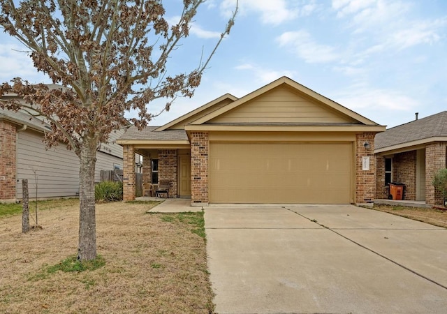 7012 Razors Edge Dr, Austin, TX 78744 - single story home featuring brick siding, concrete driveway, a garage, and a front yard
