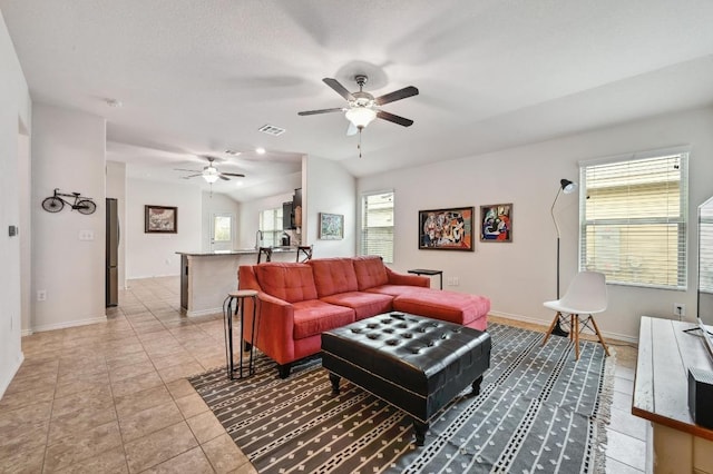 7012 Razors Edge Dr, Austin, TX 78744 - living area with ceiling fan, baseboards, and light tile patterned floors