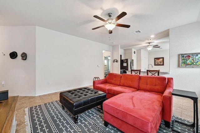 7012 Razors Edge Dr, Austin, TX 78744 - living room featuring a ceiling fan, baseboards, and tile patterned floors