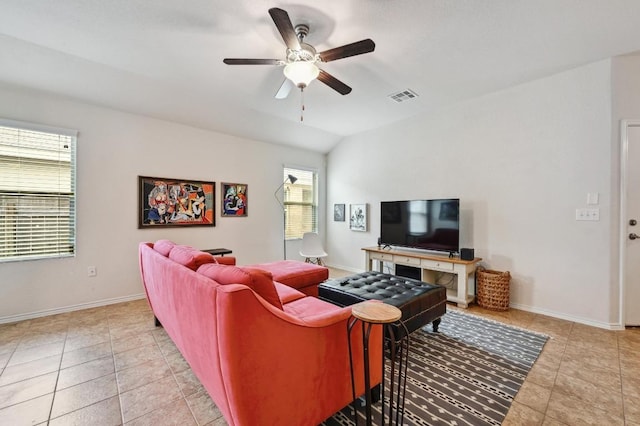 7012 Razors Edge Dr, Austin, TX 78744 - living area featuring ceiling fan, light tile patterned floors, vaulted ceiling, and baseboards