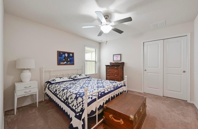7012 Razors Edge Dr, Austin, TX 78744 - carpeted bedroom with a closet, ceiling fan, and baseboards