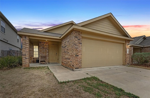 7012 Razors Edge Dr, Austin, TX 78744 - single story home with brick siding, a garage, and driveway