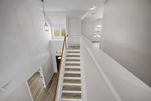10933 Casitas Dr, Austin, TX 78717 - stairway featuring wood finished floors and baseboards