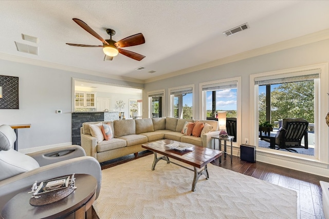14415 Echo Blf, Austin, TX 78737 - living room featuring a ceiling fan, ornamental molding, and dark wood-type flooring