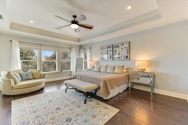 14415 Echo Blf, Austin, TX 78737 - bedroom featuring a tray ceiling, crown molding, dark wood finished floors, a ceiling fan, and recessed lighting