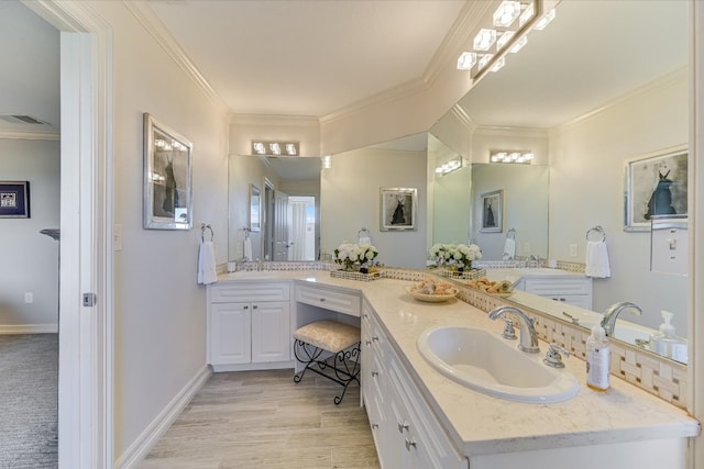 14415 Echo Blf, Austin, TX 78737 - bathroom with crown molding, double vanity, and wood finished floors