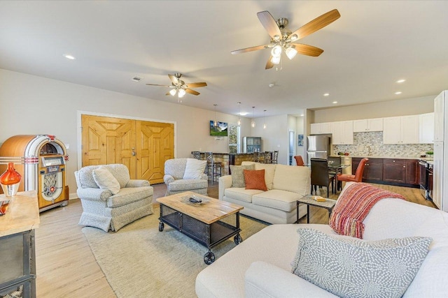 14415 Echo Blf, Austin, TX 78737 - living room with light wood-style flooring, ceiling fan, and recessed lighting