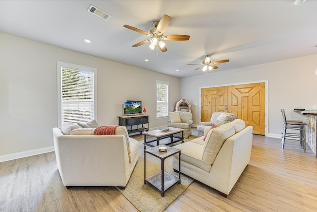 14415 Echo Blf, Austin, TX 78737 - living area with light wood-type flooring, plenty of natural light, ceiling fan, and recessed lighting