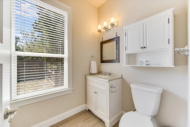 14415 Echo Blf, Austin, TX 78737 - half bath with plenty of natural light, vanity, and wood finished floors