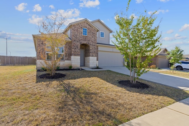 5825 Roderick Dr, Austin, TX 78724 - traditional home with driveway, an attached garage, brick siding, and stone siding