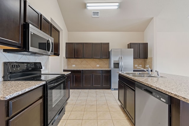 5825 Roderick Dr, Austin, TX 78724 - kitchen featuring appliances with stainless steel finishes, a sink, decorative backsplash, dark brown cabinets, and light countertops