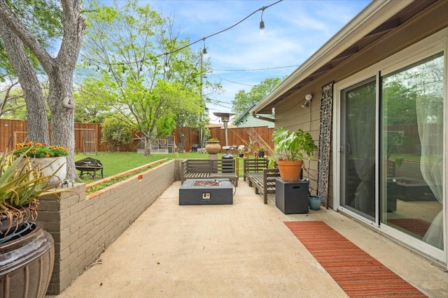 2402 Stevens Cv, Austin, TX 78723 - fenced backyard featuring a fire pit and a patio area