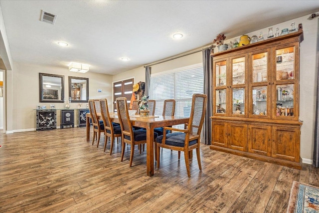 2402 Stevens Cv, Austin, TX 78723 - dining space with wood finished floors, recessed lighting, and beverage cooler