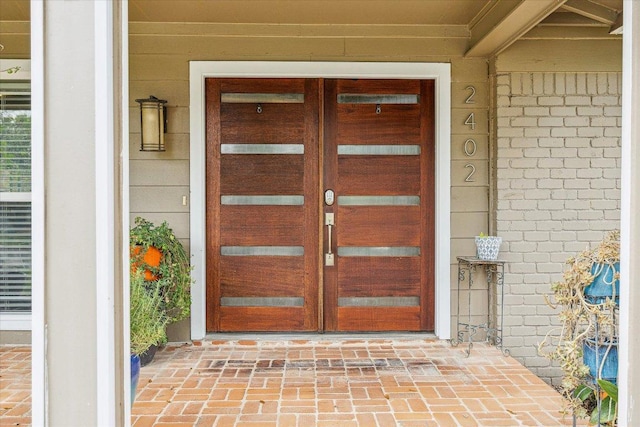 2402 Stevens Cv, Austin, TX 78723 - doorway to property with french doors and brick siding