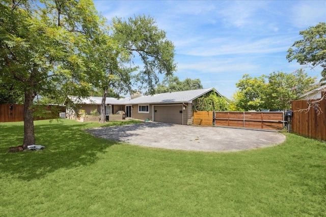2402 Stevens Cv, Austin, TX 78723 - view of yard featuring an attached garage