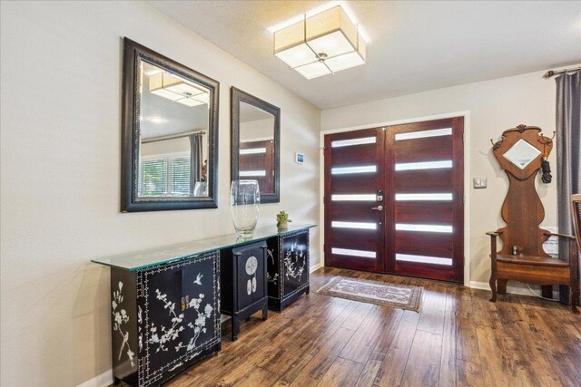 2402 Stevens Cv, Austin, TX 78723 - foyer entrance with dark wood-type flooring and baseboards
