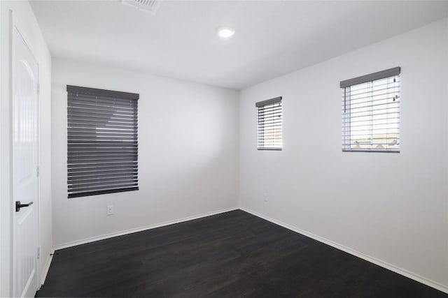 12024 Roving Pass, Elgin, TX 78621 - spare room featuring dark wood finished floors, baseboards, and recessed lighting