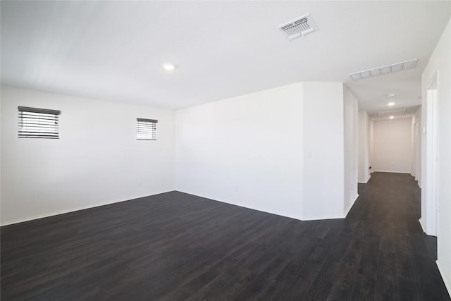 12024 Roving Pass, Elgin, TX 78621 - unfurnished room with dark wood-style flooring, baseboards, attic access, and recessed lighting